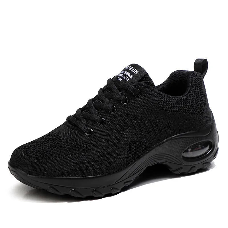 Women's red low-top lace-up mesh sneakers with round toe and a visible mid-height sole.