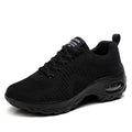 Women's red low-top lace-up mesh sneakers with round toe and a visible mid-height sole.