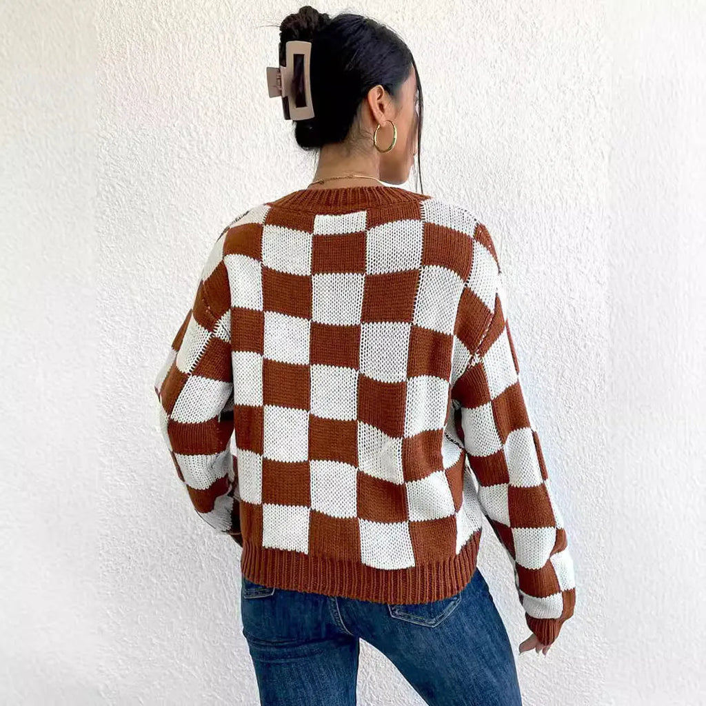 Dark brown loose plaid pullover sweater with long sleeves and a round neck.