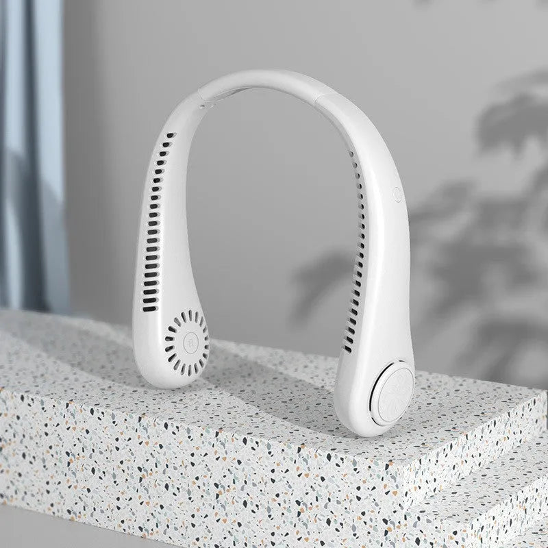 Pink bladeless neck fan with soft neckband, showing USB charging port and control buttons.