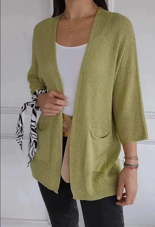 Women's waffle texture cardigan coat with nine-quarter sleeves in army green colour showing pocket details