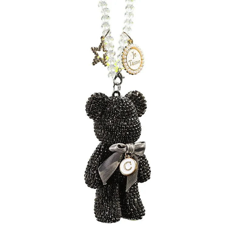 Diamond-embedded Violent Bear car rearview mirror pendant in black, white, and mixed pastel colours.