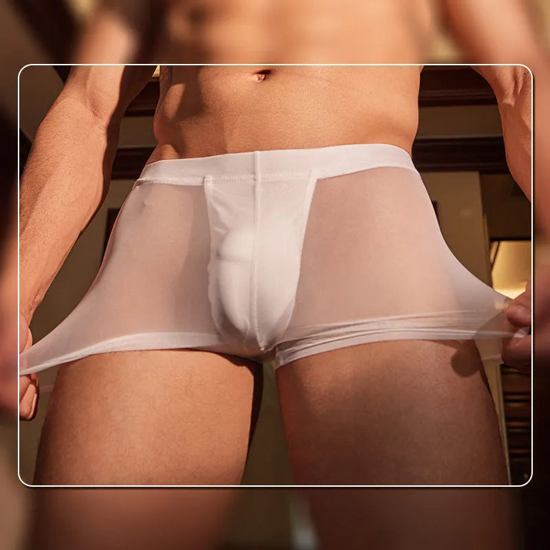 A pair of black men's nylon boxer briefs laid flat, showing their ultra-thin design.