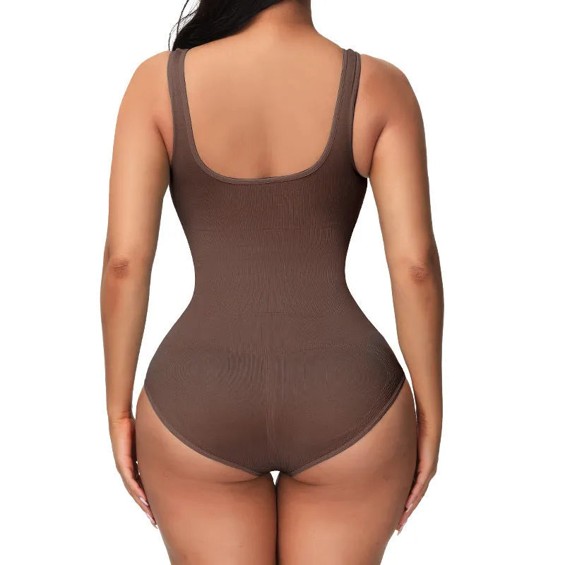 Women's seamless nylon shaping bodysuit in apricot colour on a hanger.