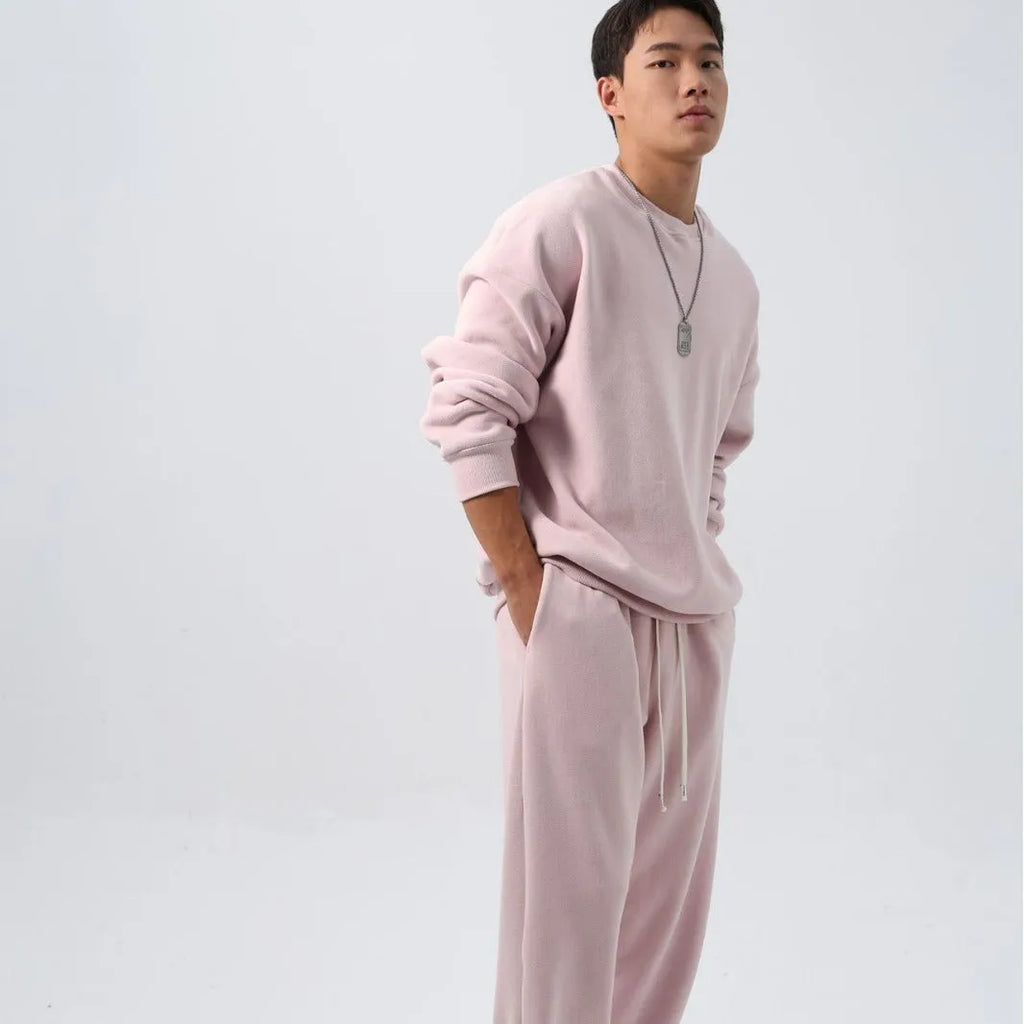 Men's black polar fleece sports suit with long sleeve crew neck coat and loose fit trousers.