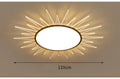 Modern round aluminium LED ceiling lamp with remote control for dimming and colour change.