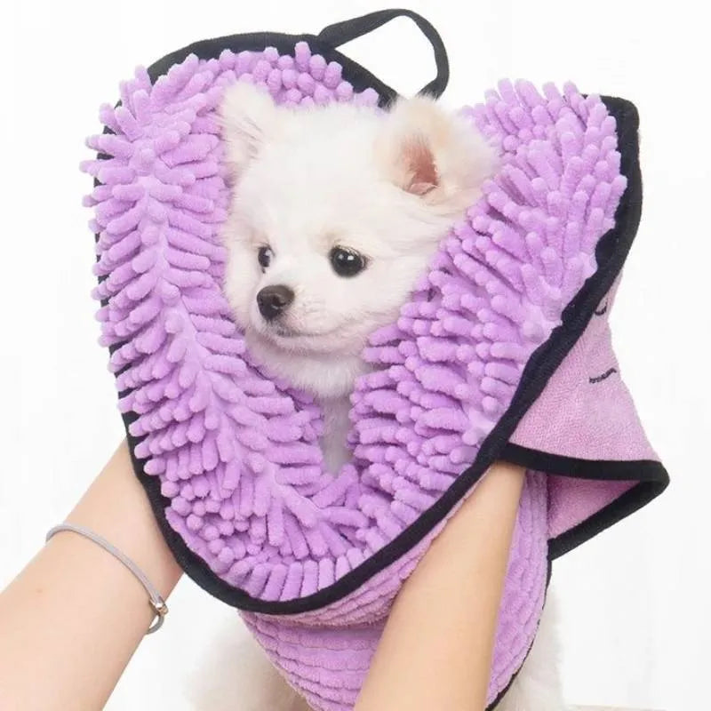 Blue pet bath robe towel wrapped around a small dog, showing its size and absorbent fabric.