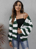 Blue striped women's cardigan sweater with button front and regular sleeves on a hanger.