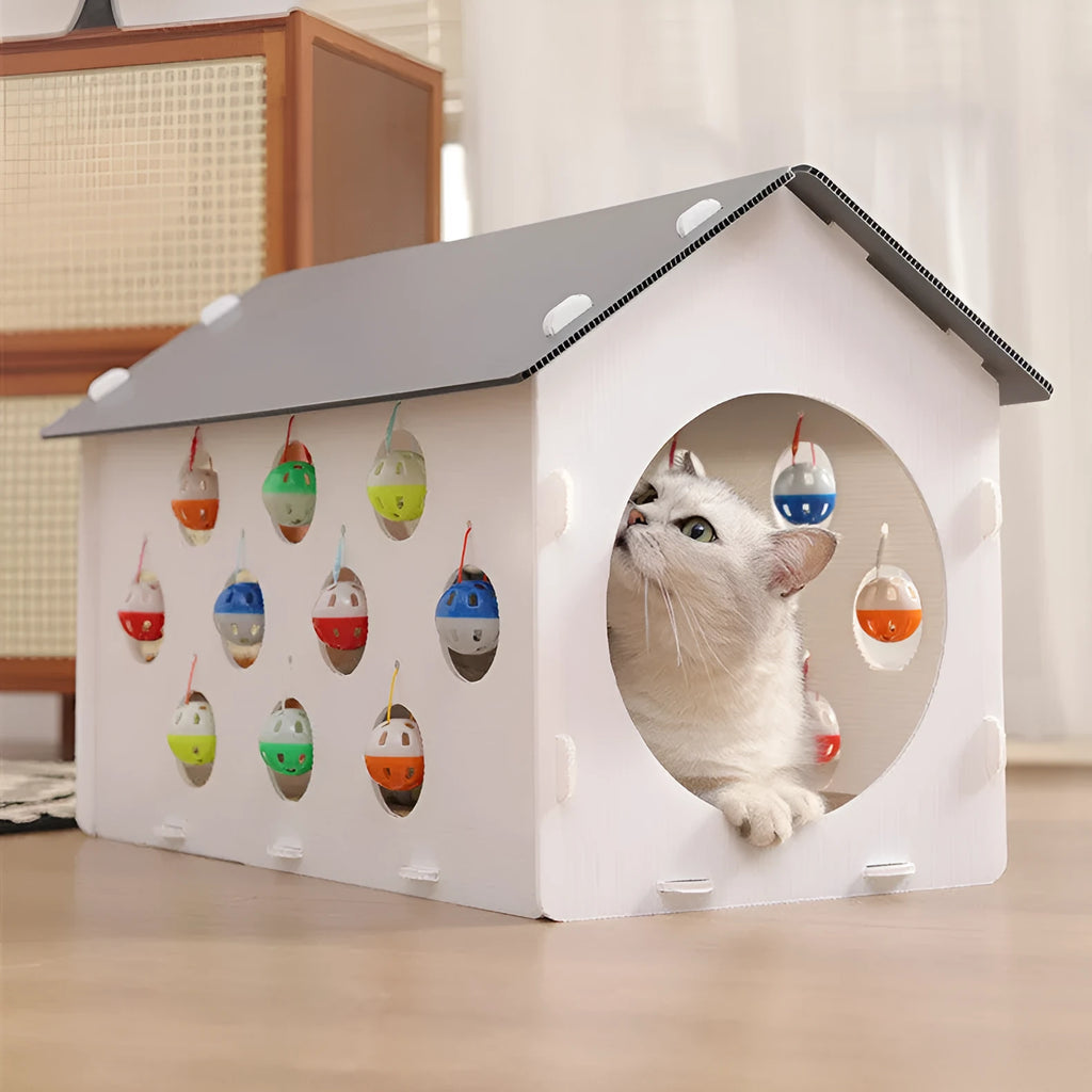 Plastic cat scratch board integrated with tunnel and nest containing bell ball