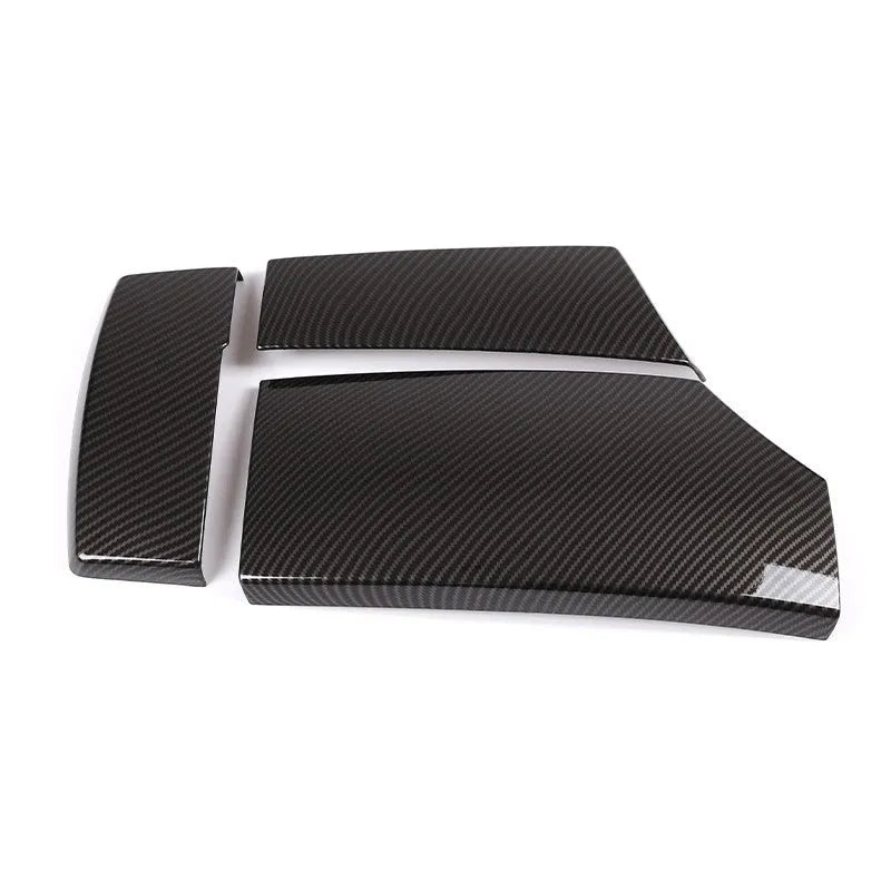 Three ABS carbon fibre pattern armrest box protective covers showing buckle attachment points