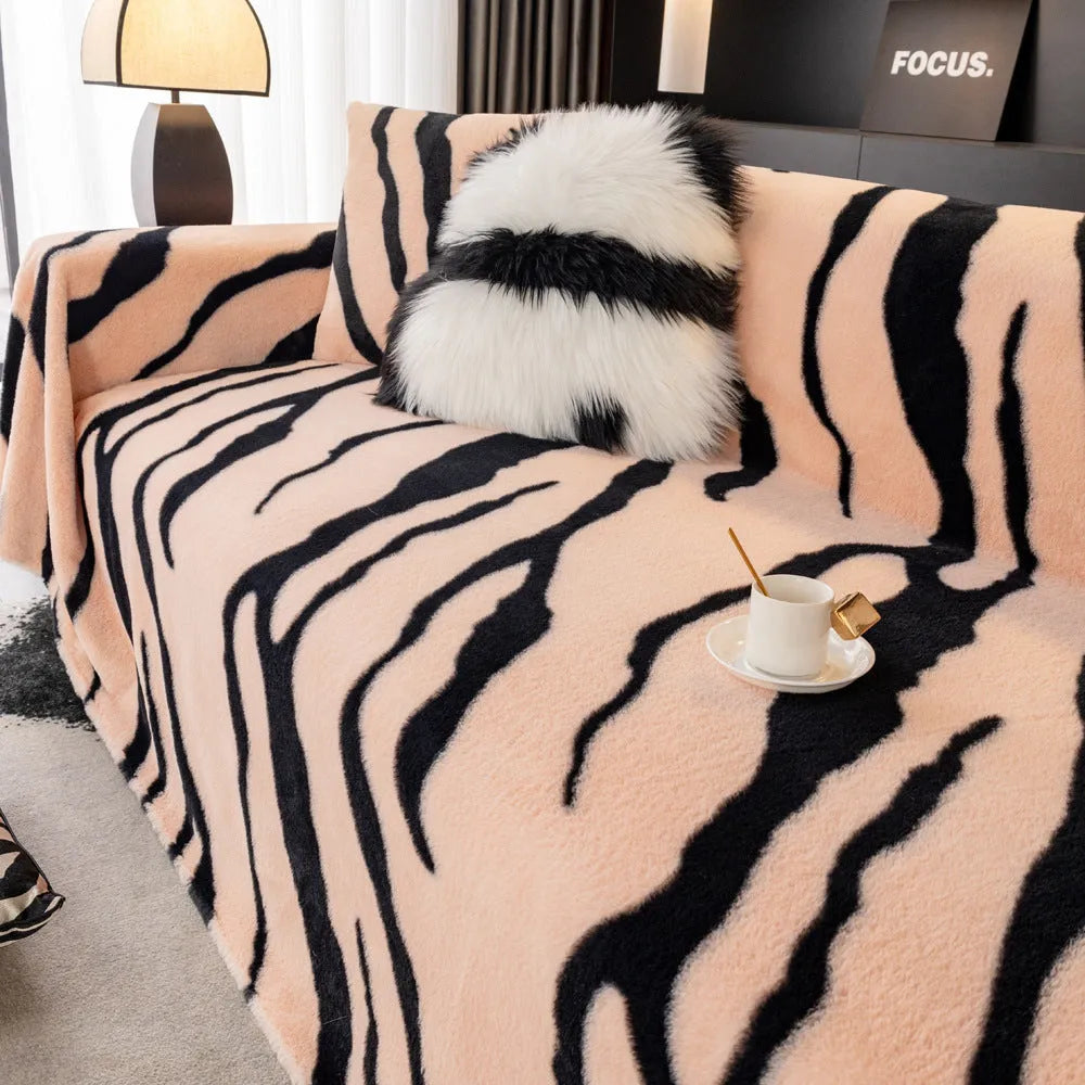 Zebra pattern flannel sofa cover with non-slip design shown on living room furniture