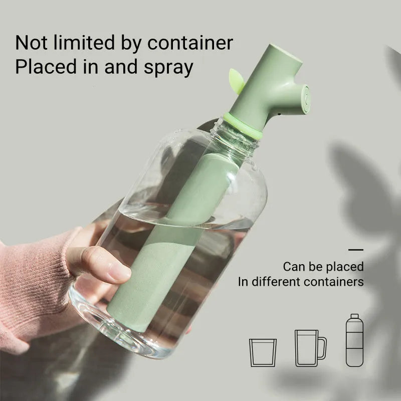 Transparent mini USB humidifier with water bottle design showing adjustable mist output