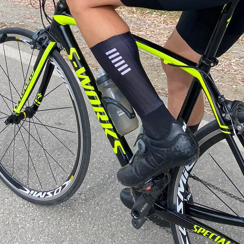 Athletic sports socks for cycling and running in multiple colour options with moisture-wicking fabric