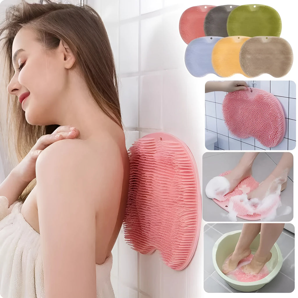 Orange non-slip silicone bath massage mat with suction cups on a bathroom floor.