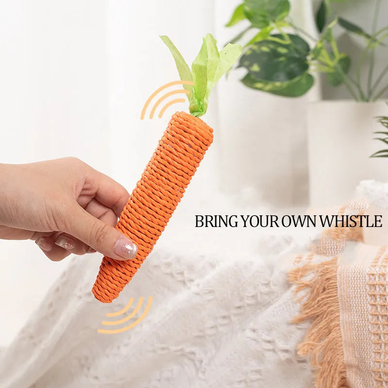 Set of cat toys including carrot shapes, crinkly paper balls, ringing stones, and dental grinding sticks in two sizes.