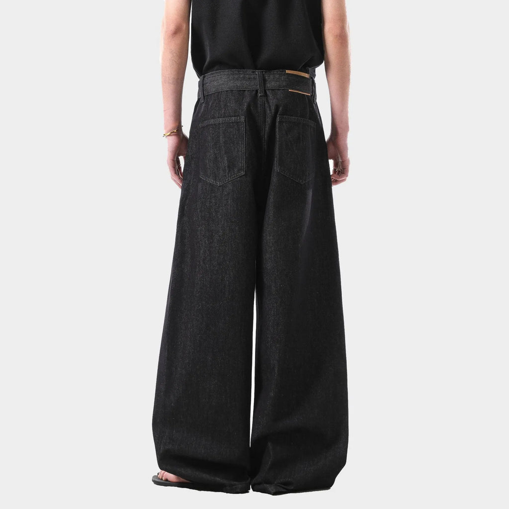 Black high waist straight leg women's jeans made from cotton denim on a model.