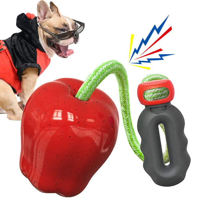 Green apple-shaped plastic dog toy with food dropping ball for interactive feeding and dental chewing