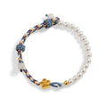 Peach-coloured Chinese flower weaving carrying strap with pearl accents on cord material
