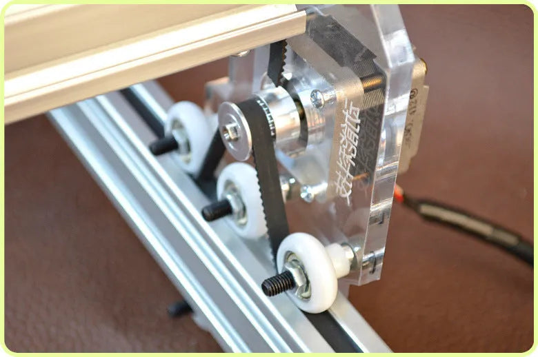 Miniature desktop laser engraving machine for marking and lettering with a 400mm x 300mm base plate.