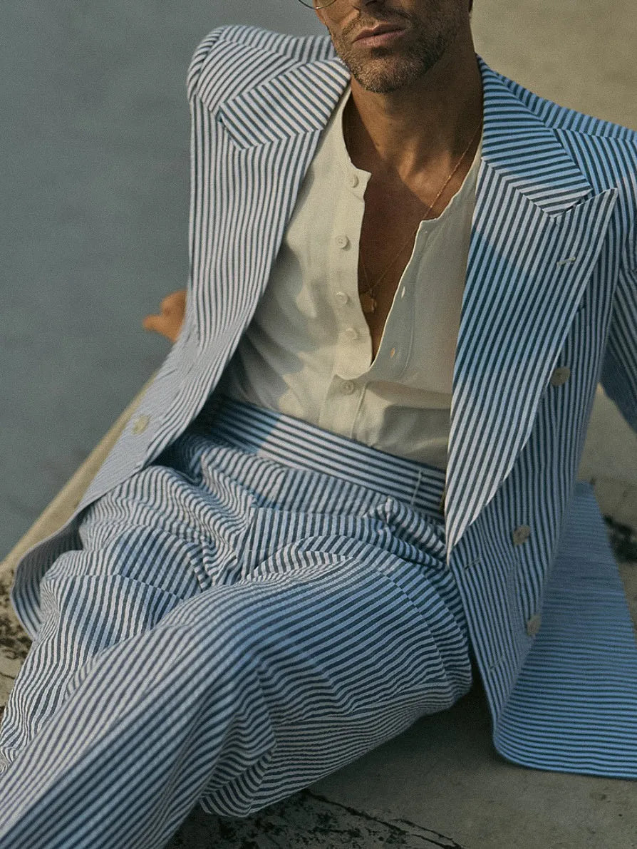 Blue and white striped men's suit set with polyester blazer and trousers on hanger