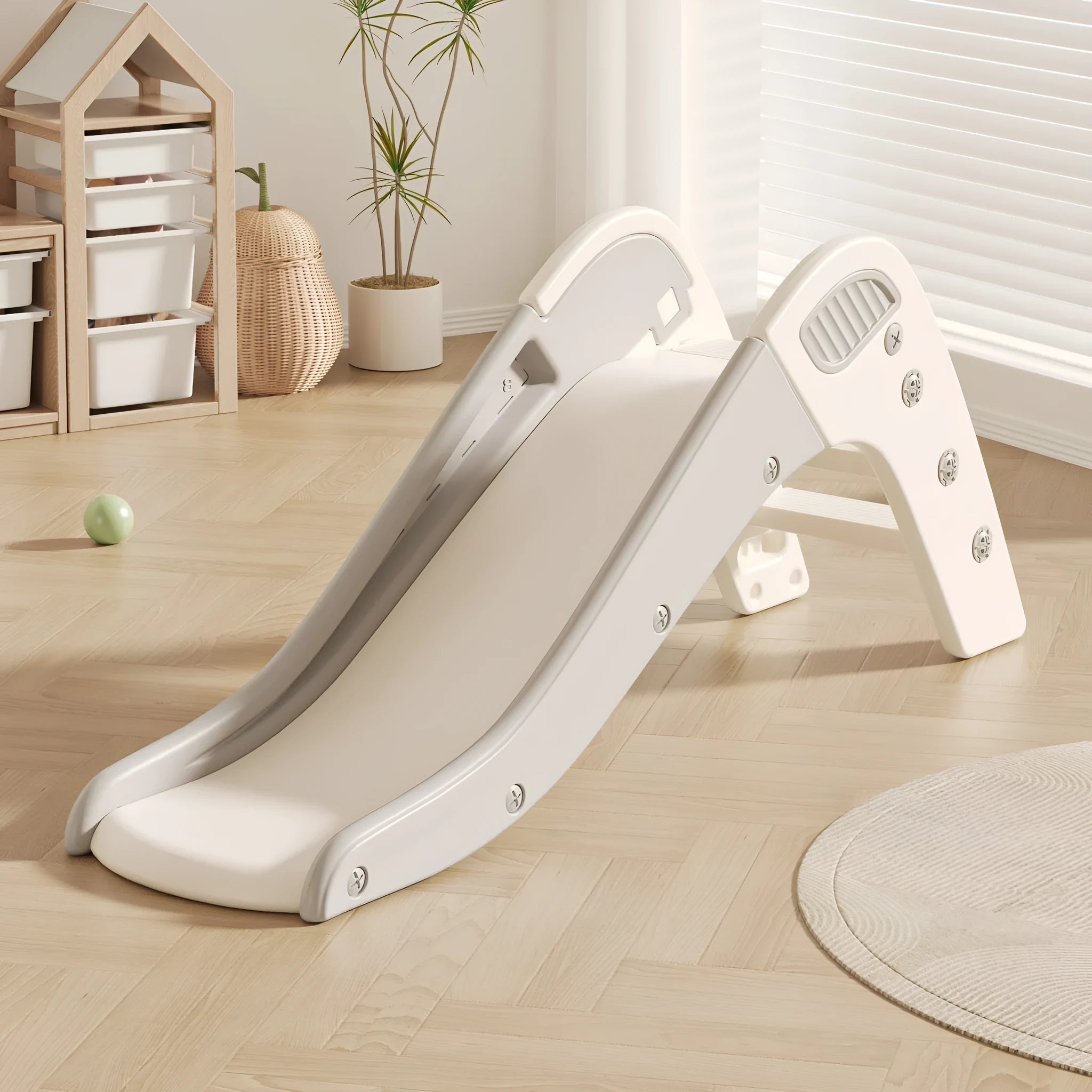 A small plastic baby slide in blue, yellow, brown, or grey, for children under three years old.