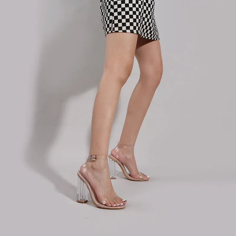 Apricot colour women's high-heel sandals with a glass-effect heel and round toe, showing the buckle fastening.