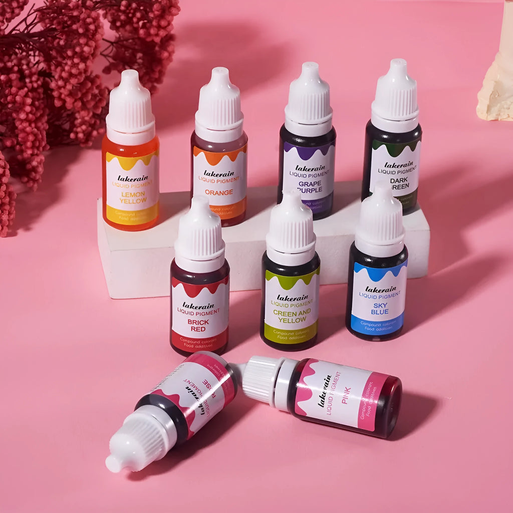 Set of 24 small bottles of cream cake and soap pigment colours with crafting tools like glitter and a sponge.