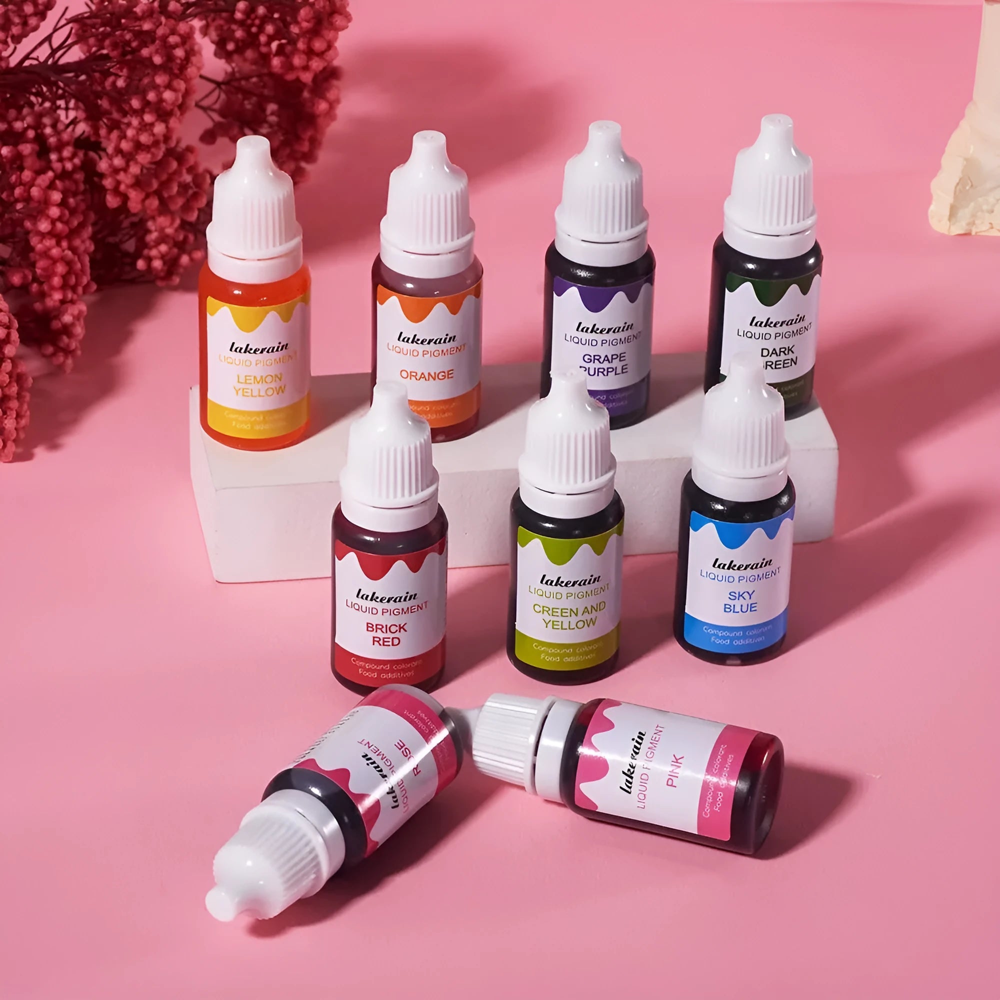 Set of 24 small bottles of cream cake and soap pigment colours with crafting tools like glitter and a sponge.