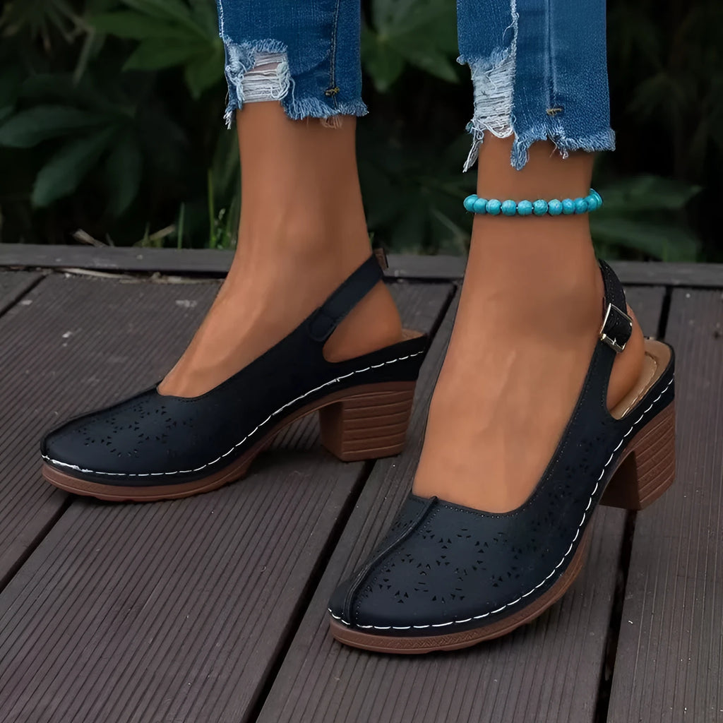 Women's black closed toe wedge sandals with round toe and PU upper on a rubber sole.