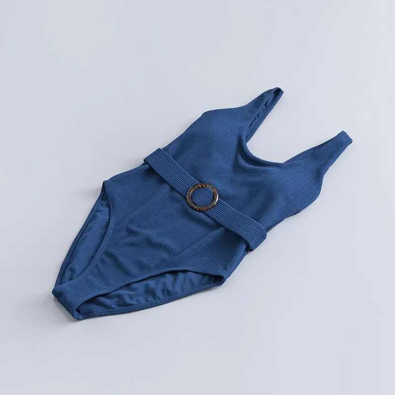 Navy blue women's one-piece swimsuit with triangle slimming design and chest pad support