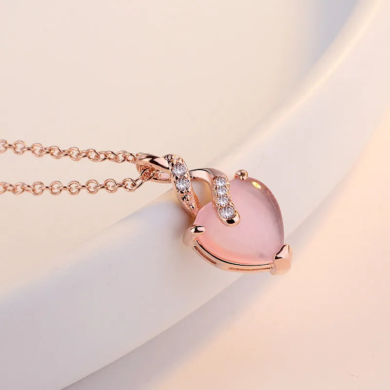 Women's heart-shaped synthetic crystal pendant necklace with rose gold cross chain