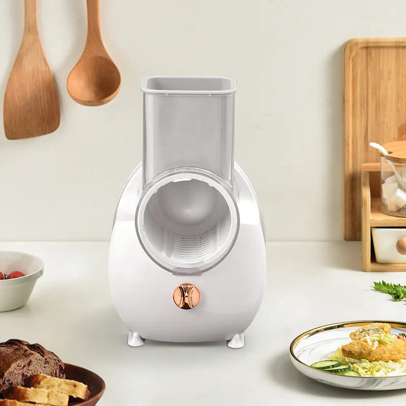 White electric vegetable slicer with rotary grater, suction base, and interchangeable blades
