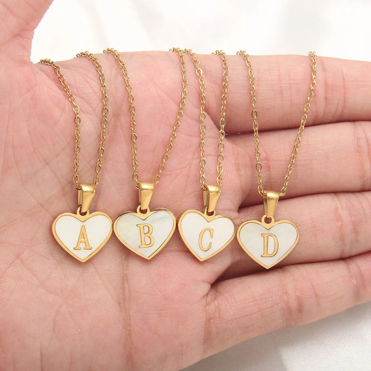 Gold plated heart necklace with white shell centre on a 45+5cm chain
