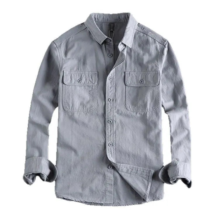 Man wearing a loose fit long sleeve overalls shirt in polyester, cardigan style.