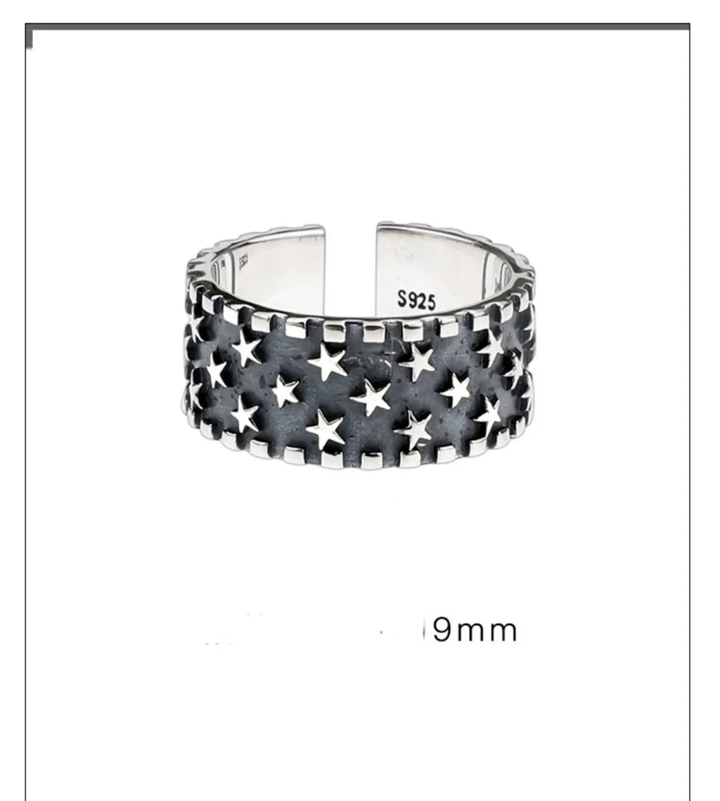 Adjustable pure silver ring with a geometric multi five-pointed star design on a silver band