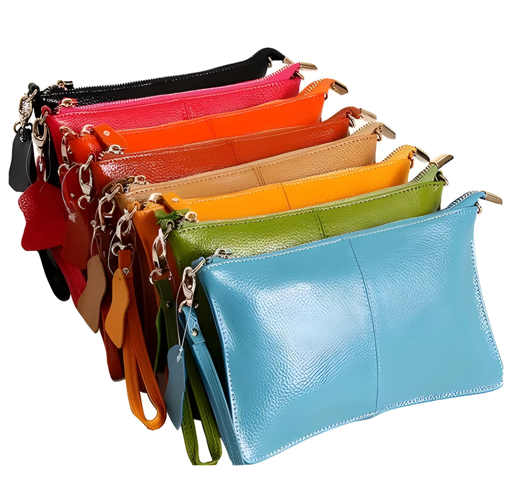 Cowhide lady's slant bag showing front compartment, adjustable long shoulder strap, and hand strap in a choice of colours