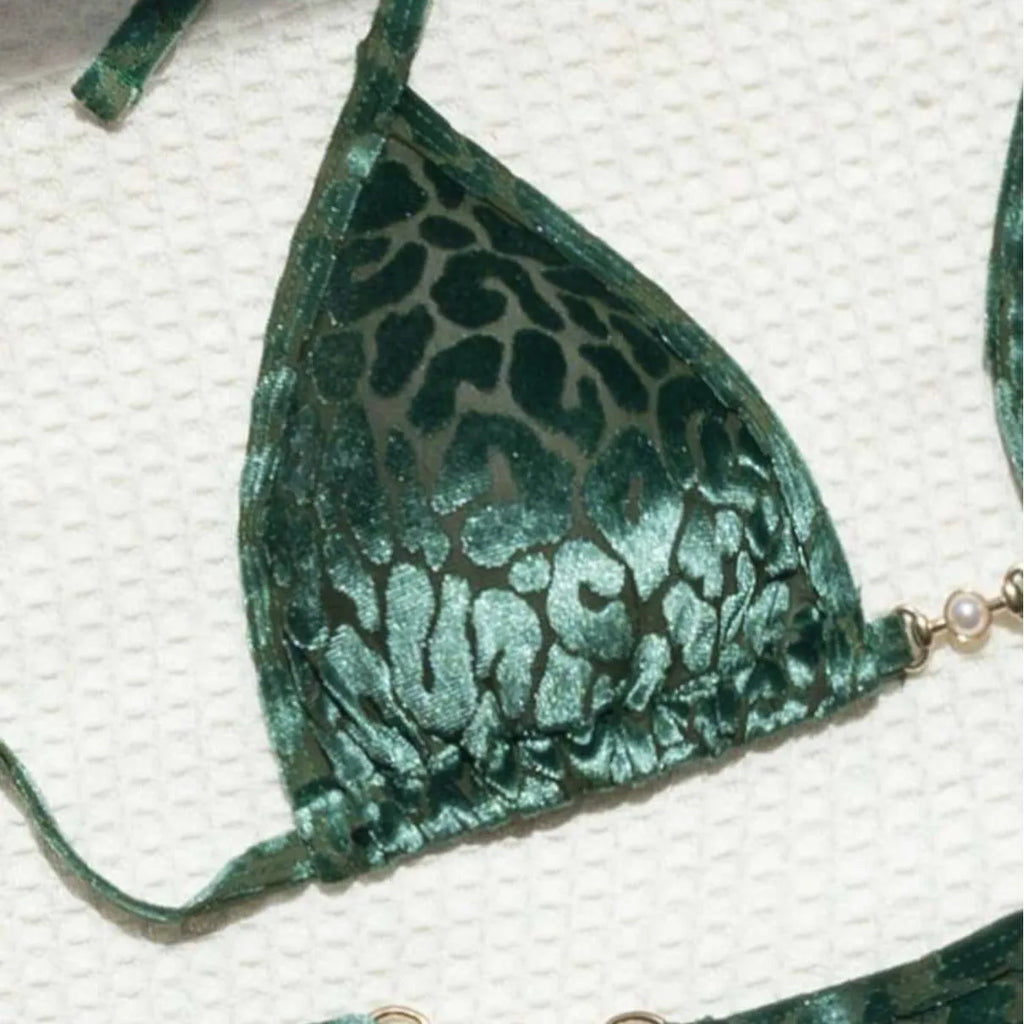 Blue leopard print women's polyester bikini set on a yellow background, showing a T-shaped sleeveless design.