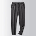 British retro striped straight-leg men's trousers in a dark colour, laid flat to show the zip fly and full length.