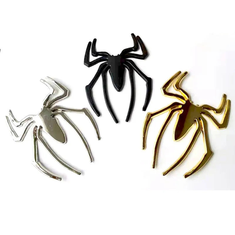 Gold 3D metal spider bumper sticker on a car bumper