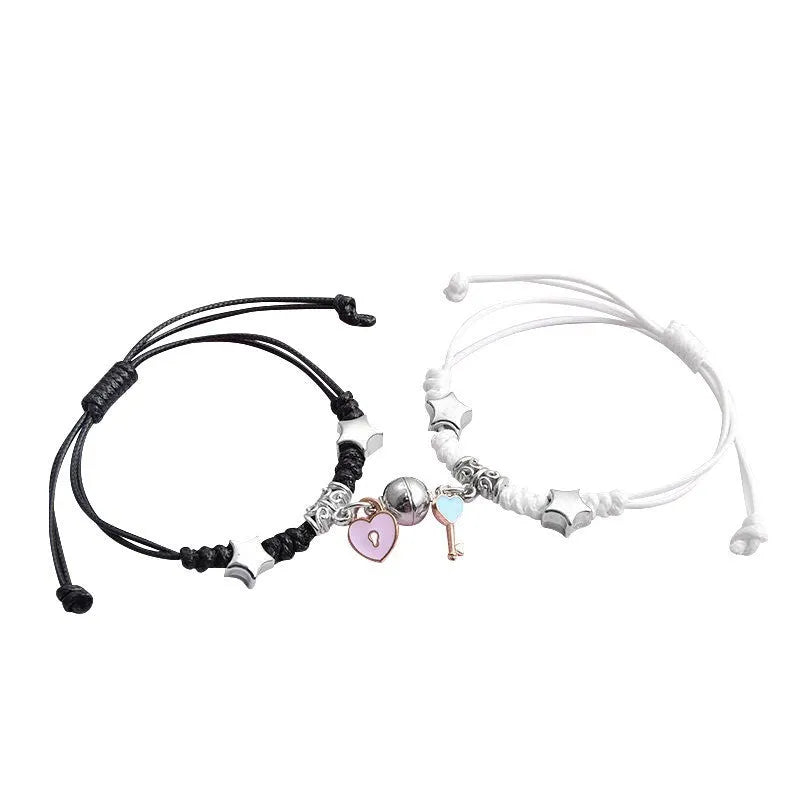 Magnetic couple bracelets with suction clasp showing various charm designs like a crown, clover, and love lock.