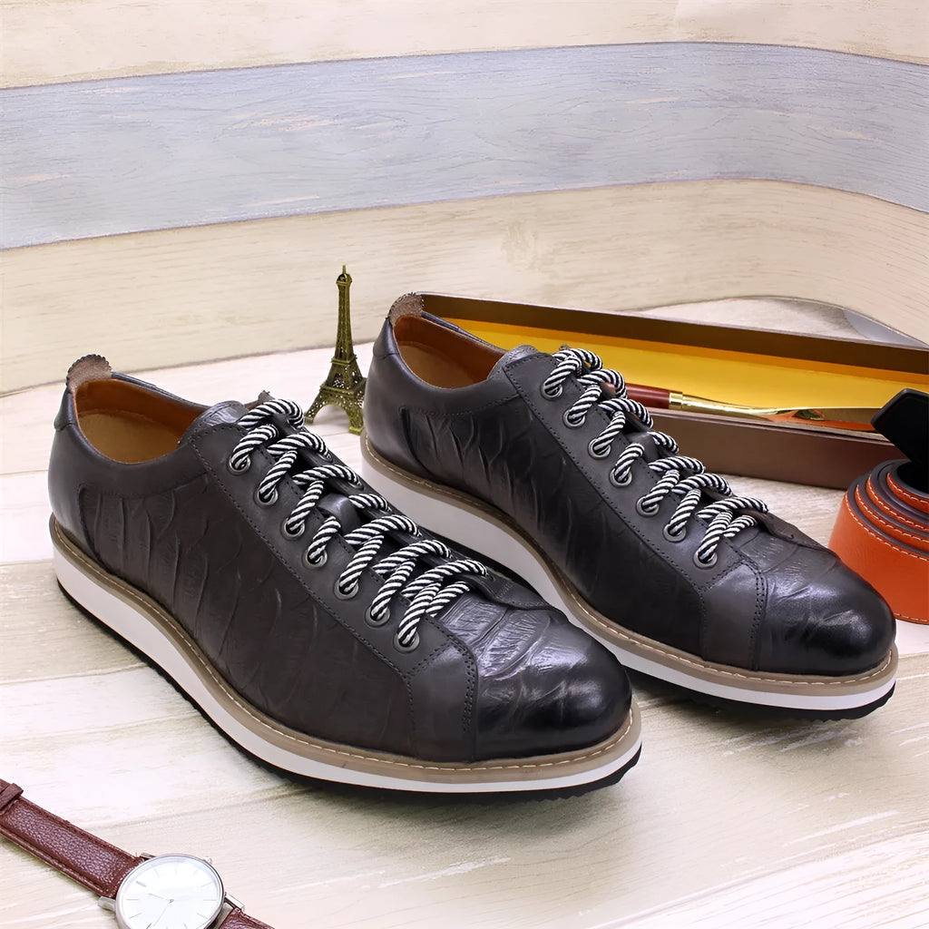 Men's handmade black leather shoes with embossed pattern, low tube height, and front lace-up fastening.