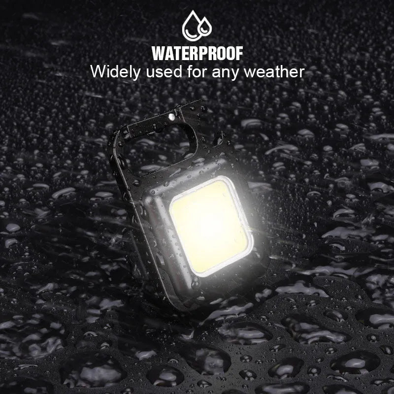 Black aluminum alloy USB rechargeable keychain light with magnetic base and foldable handle