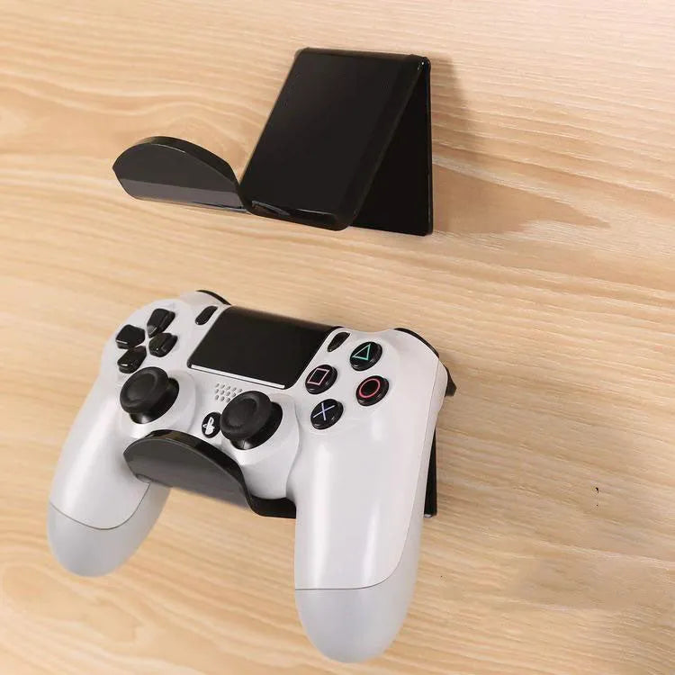 Universal plastic wall mount bracket for game controllers in black, white and transparent colours.