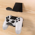 Universal plastic wall mount bracket for game controllers in black, white and transparent colours.