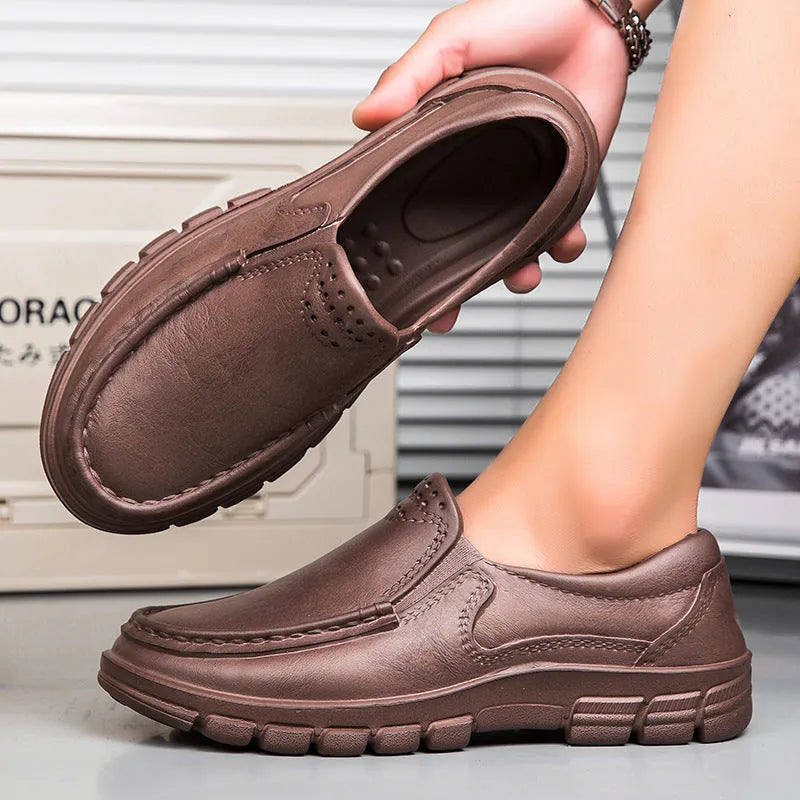 Men's black leather slip-on shoe with a mid-top design and platform sole