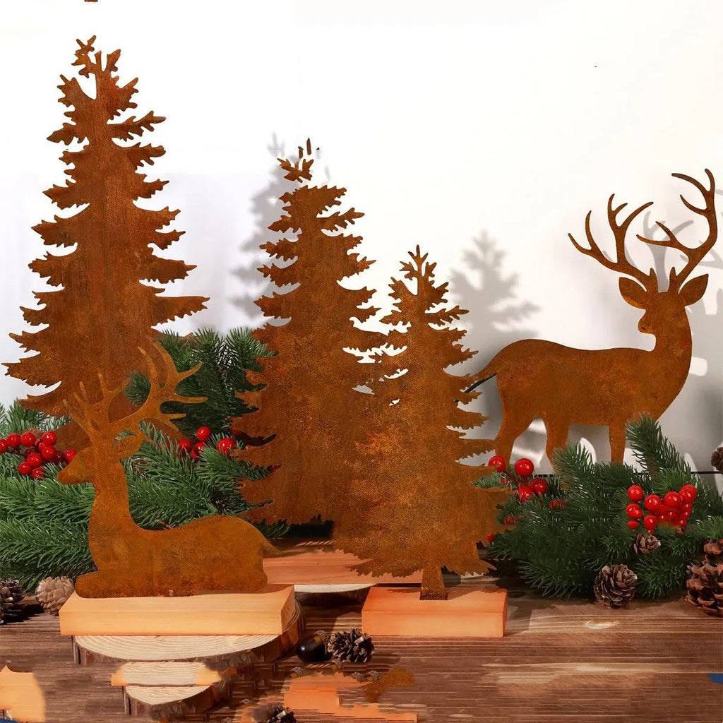 Set of three rusty metal Christmas tree decorations with elk silhouettes on a rustic surface.