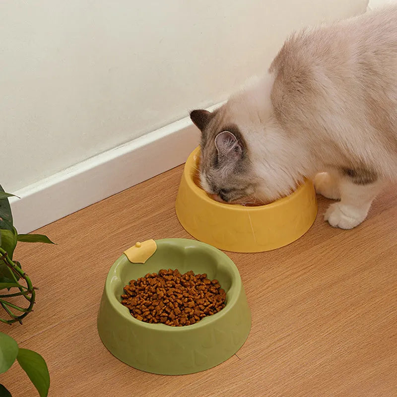 Green plastic anti-tipping pet bowl for dog and cat food and water.