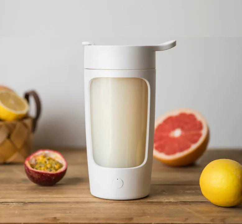 Portable rechargeable blender cup in black, blue, pink, and white colours, showing 650ml capacity and compact size.