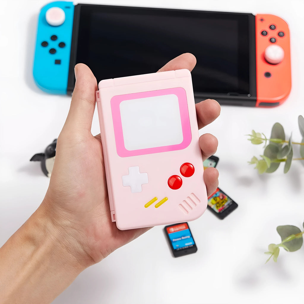 Small blue Nintendo SWITCH game card storage box next to game cards.