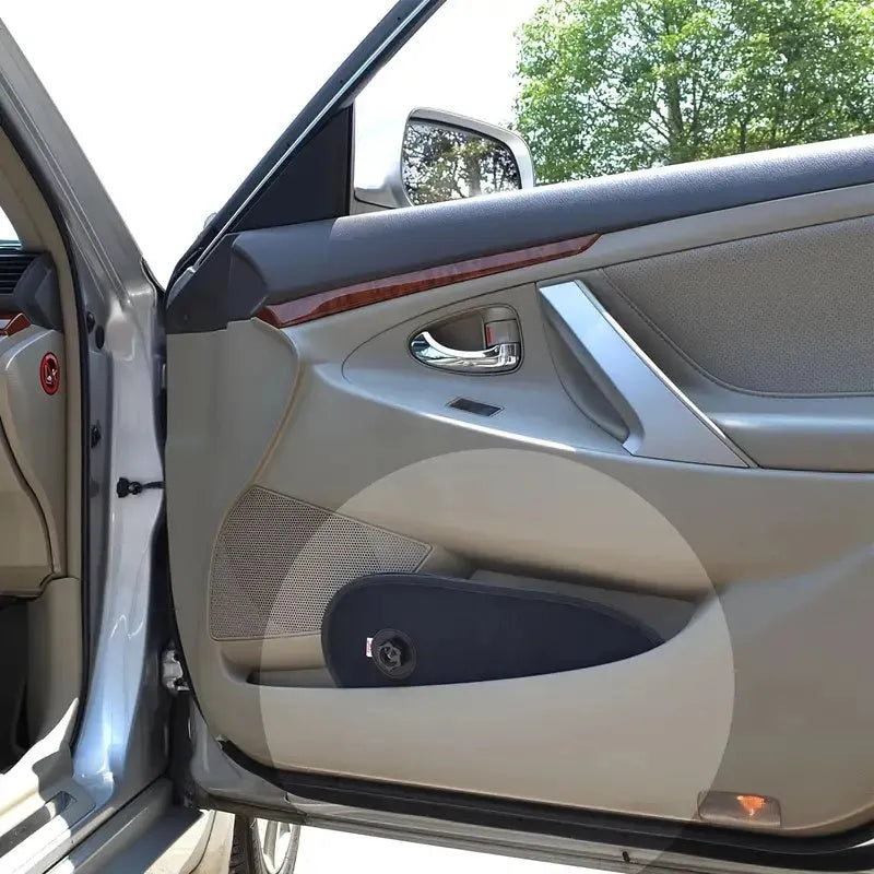 Black adjustable car side window sunshade with suction cups stretched over glass